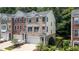 Beautiful brick and vinyl townhome with a two-car garage and manicured landscaping at 3733 Chattahoochee Summit Se Dr # 7, Atlanta, GA 30339
