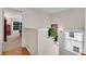 Hallway with plants and natural light, a transition between spaces inside this beautiful home at 3733 Chattahoochee Summit Se Dr # 7, Atlanta, GA 30339
