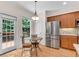 Bright kitchen with stainless appliances and outdoor access to the backyard patio at 3733 Chattahoochee Summit Se Dr # 7, Atlanta, GA 30339