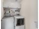 Efficient laundry area featuring a washing machine, dryer, and overhead storage cabinets at 3733 Chattahoochee Summit Se Dr # 7, Atlanta, GA 30339