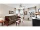 Cozy living room featuring a comfortable sofa, a table, artwork and large windows with neighborhood views at 3733 Chattahoochee Summit Se Dr # 7, Atlanta, GA 30339