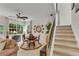 Cozy living room with natural light, ceiling fan, round dining table and staircase at 3733 Chattahoochee Summit Se Dr # 7, Atlanta, GA 30339