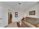 Comfortable living room showcasing a sofa, a table, and art, adjacent to a closet and the bathroom at 3733 Chattahoochee Summit Se Dr # 7, Atlanta, GA 30339