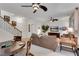 Spacious living room with staircase and dining area, features a large TV and comfortable furnishings at 3733 Chattahoochee Summit Se Dr # 7, Atlanta, GA 30339