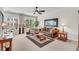 Cozy living room with plush furniture, neutral decor, large windows, and a ceiling fan at 3733 Chattahoochee Summit Se Dr # 7, Atlanta, GA 30339