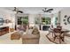 Bright living room features comfortable seating, windows with backyard views, and neutral decor at 3733 Chattahoochee Summit Se Dr # 7, Atlanta, GA 30339