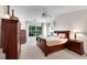 Cozy main bedroom with a large window, ceiling fan, and dark wood furnishings at 3733 Chattahoochee Summit Se Dr # 7, Atlanta, GA 30339