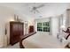 Comfortable main bedroom featuring a large window with backyard views, bright neutral paint, and modern furniture at 3733 Chattahoochee Summit Se Dr # 7, Atlanta, GA 30339