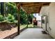 Concrete patio under deck with lush green surroundings and a side door entrance at 3733 Chattahoochee Summit Se Dr # 7, Atlanta, GA 30339