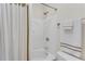 Bright shower with a shower curtain and white tiled enclosure at 3733 Chattahoochee Summit Se Dr # 7, Atlanta, GA 30339