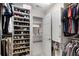 Organized walk-in closet with shoe racks and clothing, leading to an ensuite bathroom at 3733 Chattahoochee Summit Se Dr # 7, Atlanta, GA 30339