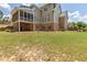 A large backyard with a screened porch and ample green space, perfect for outdoor activities and relaxation at 501 Highwater Pass, Canton, GA 30114