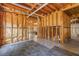 Unfinished basement with exposed beams, ductwork, and a view into a finished living area at 501 Highwater Pass, Canton, GA 30114