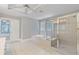 A bright and airy bathroom with a large tub and glass-enclosed shower at 501 Highwater Pass, Canton, GA 30114