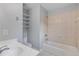 Secondary bathroom with a shower over the tub and lots of shelving at 501 Highwater Pass, Canton, GA 30114