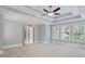 A carpeted bedroom featuring trey ceilings, an open doorway and an abundance of natural light at 501 Highwater Pass, Canton, GA 30114