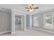 A cozy bedroom featuring neutral colors, a ceiling fan, and lots of natural light from the windows at 501 Highwater Pass, Canton, GA 30114