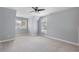 Spacious bedroom featuring neutral carpet, ample natural light, and a ceiling fan for added comfort at 501 Highwater Pass, Canton, GA 30114