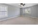 Bright and airy bedroom featuring two windows and neutral carpet, offering a comfortable retreat at 501 Highwater Pass, Canton, GA 30114