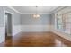 Spacious dining room with hardwood floors, detailed trim, and plenty of natural light at 501 Highwater Pass, Canton, GA 30114