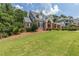A brick home with a sprawling green lawn and neatly trimmed shrubbery at 501 Highwater Pass, Canton, GA 30114