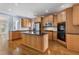 Modern kitchen with wood cabinets, stainless steel appliances, and granite island at 501 Highwater Pass, Canton, GA 30114