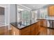 Kitchen island with granite countertop and view into the living room at 501 Highwater Pass, Canton, GA 30114