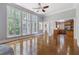 Sun-filled living room with hardwood floors and large windows at 501 Highwater Pass, Canton, GA 30114