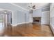 Bright living room with hardwood floors, stone fireplace, and built-in bookshelves at 501 Highwater Pass, Canton, GA 30114