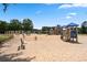 Spacious community playground area with swings, multiple play structures, benches, and other recreational facilities at 501 Highwater Pass, Canton, GA 30114