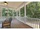 Enjoy bug-free outdoor living on this screened porch with a view of lush greenery at 501 Highwater Pass, Canton, GA 30114