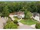 Stunning aerial view of a home surrounded by lush greenery, showcasing its well-maintained lawn and landscaping at 510 Northland Ridge Ct, Sandy Springs, GA 30342