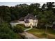 Beautiful aerial view of home at dusk, displaying the well-lit exterior and manicured grounds at 510 Northland Ridge Ct, Sandy Springs, GA 30342
