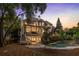 Stunning backyard features a screened porch, stone patio, and a tranquil private pool at 510 Northland Ridge Ct, Sandy Springs, GA 30342
