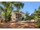 Exterior view of the home with a screened-in porch, patio and swimming pool at 510 Northland Ridge Ct, Sandy Springs, GA 30342