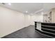 Bright basement area with tiled floors and a wet bar, perfect for entertaining guests at 510 Northland Ridge Ct, Sandy Springs, GA 30342