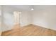 Clean bedroom featuring hardwood floors, a ceiling fan and access to the connected bathroom at 510 Northland Ridge Ct, Sandy Springs, GA 30342