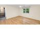 Bedroom with hardwood floors, a ceiling fan, and a window with backyard views and access to the bathroom at 510 Northland Ridge Ct, Sandy Springs, GA 30342
