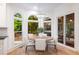 Breakfast nook with a view to the outdoors and access to the sunroom at 510 Northland Ridge Ct, Sandy Springs, GA 30342