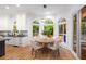 Eat-in kitchen area with oversized windows offering wooded view, light wood floor at 510 Northland Ridge Ct, Sandy Springs, GA 30342