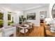 Sunlit dining room featuring a modern table set and hardwood floors at 510 Northland Ridge Ct, Sandy Springs, GA 30342
