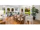 Bright dining room with hardwood floors and views of the lush greenery outside at 510 Northland Ridge Ct, Sandy Springs, GA 30342