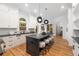 Full kitchen with sleek countertops, stainless appliances, and a dark kitchen island at 510 Northland Ridge Ct, Sandy Springs, GA 30342