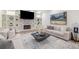 Living room with a stone fireplace, built-in shelves, and a large area rug at 510 Northland Ridge Ct, Sandy Springs, GA 30342