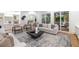 Bright living room featuring hardwood floors, stylish decor, and access to a screened-in porch at 510 Northland Ridge Ct, Sandy Springs, GA 30342
