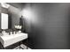 Stylish powder room with a marble sink, modern fixtures, and elegant dark wallpaper at 510 Northland Ridge Ct, Sandy Springs, GA 30342
