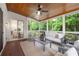 Inviting screened porch with comfortable seating, wood ceiling and views of the lush outdoors at 510 Northland Ridge Ct, Sandy Springs, GA 30342
