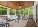 Relaxing screened porch with cozy furniture, wood ceilings, and tranquil outdoor views at 510 Northland Ridge Ct, Sandy Springs, GA 30342