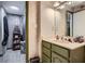Bathroom with vanity sink, large mirror, and adjoining shower area at 578 Mcgill Ne Pl # 578, Atlanta, GA 30312