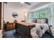 Bedroom with large window, dresser, and bed at 578 Mcgill Ne Pl # 578, Atlanta, GA 30312